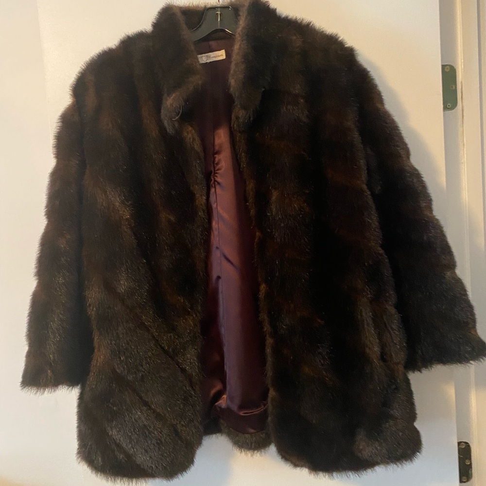 Faux fur jacket. 32” length 22” across. Top button closure two hook snaps